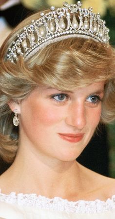 a close up of a woman wearing a tiara