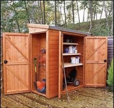 an outdoor storage shed with its doors open