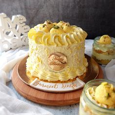 there is a cake that has been decorated with yellow icing on the top and bottom