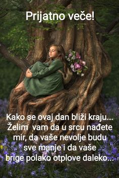 a woman sitting on top of a tree in the middle of a field with purple flowers