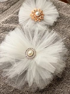 three white tulle flower hair clips with pearls and crystal brooches on top