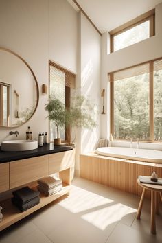 a bath room with a large tub and a sink under a mirror next to a window