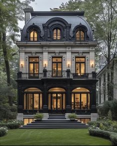 a large black and white house with lots of windows