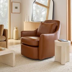 a living room filled with furniture and a mirror