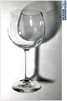 an empty wine glass sitting on top of a table