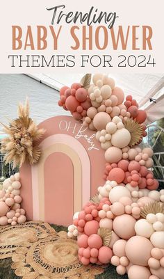 a baby shower theme with balloons and flowers