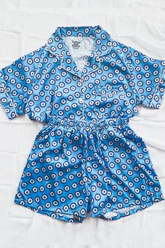 Our luxuriously soft Evil Eye Pajamas are perfect for weddings, bridal parties, holidays, getaways, bachelorette weekends, vacations, or just lounging at home. Features a button front shirt and elastic waist bottoms. Shorts feature hidden pockets. These pajamas are in production and require 5-6 weeks before shipment. Relaxed Fit Satin Sleepwear For Loungewear, Relaxed Fit Satin Sleepwear For Bedtime, Satin Lounging Set For Summer, Summer Satin Lounging Set, Summer Sleepwear With Elastic Waistband, Casual Satin Sleep Sets, Blue Satin Sleepwear For Pajama Party, Blue Satin Bedtime Sets, Blue Satin Sleep Set