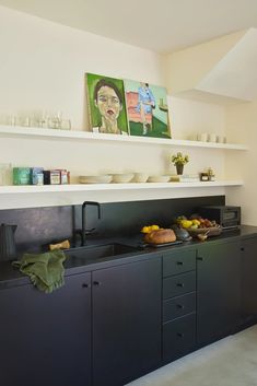 the kitchen is clean and ready to be used for breakfast or dinner time, with dishes on the counter