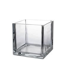 a square glass vase sitting on top of a white surface