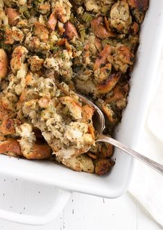 a casserole dish filled with stuffing and vegetables