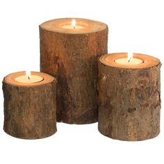 three wooden candles sitting next to each other