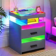 an illuminated night stand with two drawers