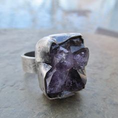 Raw Amethyst Druzy Ring Purple Rough Gemstone Crystal Rustic Silver Ring: Chunky rustic ring of natural raw Amethyst set in sterling silver. I hammered, stamped and distressed the bezel and the band for an organic look. Size is 7.5. 100% handmade by me in all sterling silver in my little home studio. Enter my shop: https://www.etsy.com/shop/artdi Join me on Facebook: https://www.facebook.com/Artdi-Diana-Anton-Jewelry-Design-44805607932/ Find me on Instagram: https://www.instagram.com/dianaantonjewelrydesign/ Elven Witch, Rough Gemstone Jewelry, Witch Rings, Rustic Ring, Rough Jewelry, Raw Crystal Ring, Amethyst Set, Rustic Rings, Ring Purple