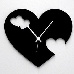 a clock that is shaped like a heart