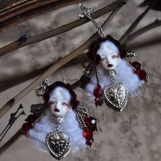 These Vampire Princess II Gothic Doll Jewelry are a unique and striking addition to any gothic or Art Doll collection. Handcrafted by our skilled artisans, each piece is made with ultra-light clay, resin clay, wool or rayon, and metal fittings. The result is a lightweight earring that is comfortable to wear all day long. These earrings are designed with a creepy cute doll aesthetic and measure approximately 8x3.4 cm (3.15 x 1.34 inches) in size. Please note that the price is for a single earring or brooch, and if you want a pair of earrings, please order two. To take care of your earrings, avoid soaking, squeezing, tearing, rubbing, or scratching them, and store them in a box when not wearing them. Vampire Doll Aesthetic, Gothic Resin Art, Handmade White Gothic Earrings, White Gothic Handmade Earrings, Vampire Red Aesthetic, Goth Gift Ideas, Spooky Jewelry, Doll Earrings, Vampire Princess