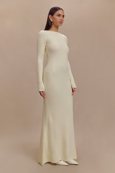 Elegant flow. The EMILY Long Sleeve Knit Maxi Dress is a stunning blend of modern elegance and timeless sophistication. Featuring a boat neckline and long sleeves, this dress creates a graceful, refined silhouette. The open back keyhole with a bow closure adds a touch of romantic detail, while the bodycon fit accentuates your curves. The flared hem provides a flowing, dramatic effect, and the maxi length ensures a glamorous finish. Crafted from ribbed knit and unlined, the Emily Dress offers bot Long Sleeve Knit Maxi Dress, Workwear Capsule Wardrobe, Workwear Capsule, Capsule Wardrobe Basics, European Summer Outfits, Knit Maxi Dress, Maxi Dress Sale, Black Tie Wedding, Beige Dresses