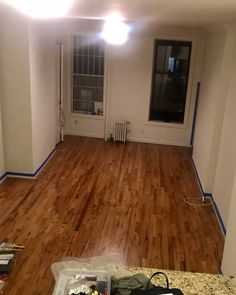 an empty room with hard wood flooring and white paint on the walls is shown