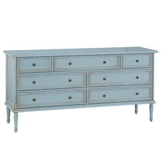 a blue dresser with six drawers and two pulls on the bottom, in front of a white background