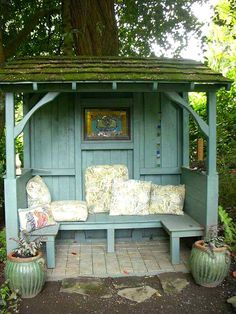 an image of a garden bench made out of old doors and shutters, with the caption're - escape com attach a little sitting cabana to the front of your shed '