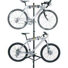 a bicycle is mounted to the side of a pole with two bicycles on it's sides