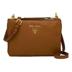 This fabulous Prada crossbody is perfect for your everyday outfit. The gold-toned Prada emblem pairs perfectly with the brown calf leather. The smooth, textured leather adds a luxurious element to the minimalist look of Prada's crossbody bag. This convenient crossbody has two separated zipper compartments as well as an adjustable crossbody strap. Model: 1BH046 Brown Vitello Phenix Leather Gold-Toned Hardware Two Zipper Compartments One Interior Zip Pocket One Interior Slip Pocket Adjustable Cros Prada Crossbody, Prada Crossbody Bag, Everyday Outfit, Crossbody Strap, Handbag Accessories, Cloth Bags, Pebbled Leather, Cross Body Handbags, Everyday Outfits