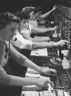 an old photo of women working in a radio control room