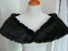 "I made this shoulder shrug out of black mink faux fur and lined the wrap with black fleece for warmth and comfort. The shawl is 43\" long on the upper cut, cut on a curve for a better fit, and 8\" wide(long) at the back. You can pin in place or add your own special piece of pinned jewelry for a perfect fit. Spot clean or dry clean. Optional hook and eye closure available." Fur Stole Wedding, Black And White Makeup, Faux Fur Shrug, Faux Fur Shawl, Fur Shrug, Faux Fur Stole, Shoulder Cape, Shoulder Wrap, Fur Shawl