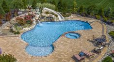 an aerial view of a backyard with a swimming pool