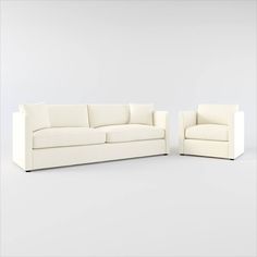 two white couches sitting next to each other