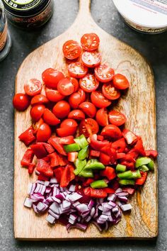 chopped tomatoes and onions on a cutting board