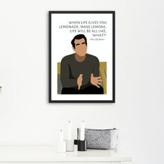 the office tv show quote art print on white wall above mantle with candles and potted plant