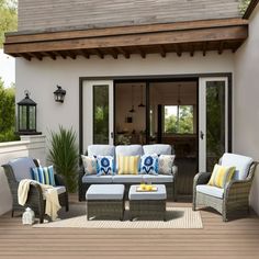 an outdoor living area with furniture and accessories