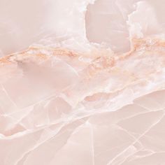 an abstract pink marble background with gold accents