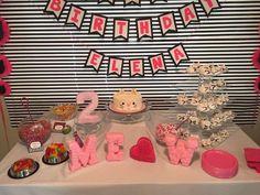 a table topped with lots of food and decorations