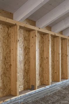 an unfinished room with wood paneling in it