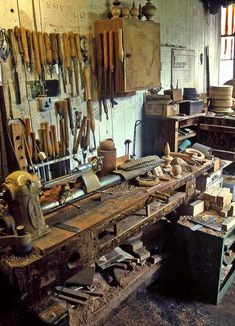 an old workbench filled with lots of tools