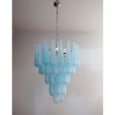 a blue chandelier hanging from a ceiling