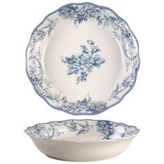 two blue and white plates sitting on top of each other