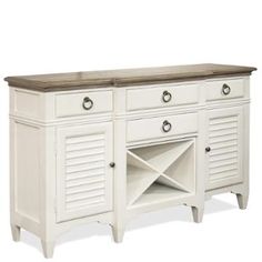 a white cabinet with two doors and drawers