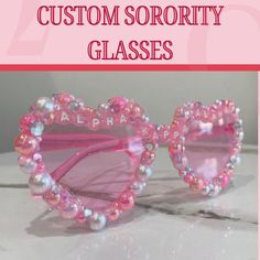 Seaching for something to complete your rush outfit? A gift for your big/little? Look no farther! All of our sunglasses are custom made upon order, allowing for control over all aspects of design. Most importantly though, our sunglasses are guaranteed to hold up. If for any reason you are not satisfied with your purchase we guarantee a full refund.  *Plastic glasses bedazzled with various plastic rhinestones and flat back pearl beads. *For multicolored beads such as the translucent letter beads and stars, colors will be chosen that best fit your theme. *Use the "personalization" text box to enter what type of gems and pearls you would like. What To Bedazzle, Custom Name Pink Sunglasses With Adjustable Fit, Pink Sunglasses With Custom Name And Adjustable Fit, Personalized Pink Sunglasses As A Gift, Pink Personalized Sunglasses For Gift, Bedazzled Glasses, Bling Glasses, Rush Outfits, Types Of Gems