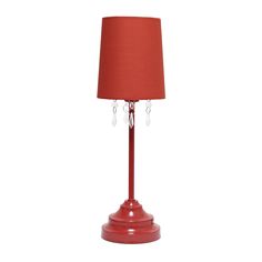 a red table lamp on a white background