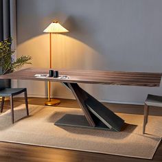 a wooden table sitting on top of a rug next to a lamp