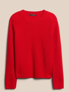 a red sweater on a hanger