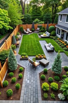 an outdoor patio with seating and landscaping in the middle, surrounded by green lawning