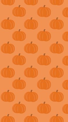 an orange background with pumpkins on it