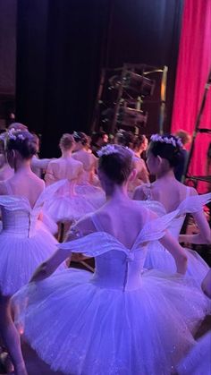 several young ballerinas dressed in white tutus