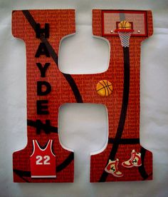 the letter h is made up of basketball jerseys and letters that spell it out