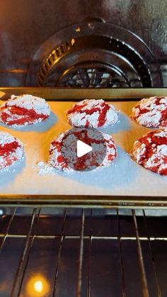 an oven filled with pastries covered in powdered sugar