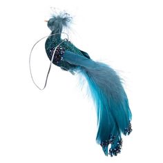 a blue bird with feathers and beads on it's tail is flying through the air