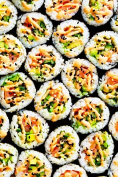 several sushi rolls with various toppings on them